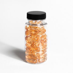 A transparent bottle filled with amber capsules against a white background, showcasing health and nutrition.