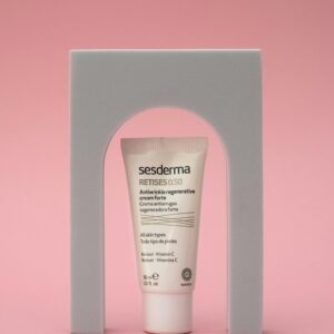 Luxury cosmetic cream displayed elegantly against a pink background with modern aesthetics.